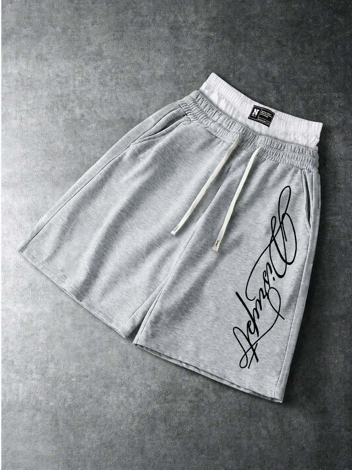 Men’s Oversized Baggy Knee Length Sweat Shorts Soft Breathable Terry Fabric Dual Layer Tartan Plaid Patchwork Waistband Elastic White Drawstring Casual Streetwear Shorts Elegant Cursive Script Signature White Letter Print Side Pocket Loose Summer Athletic